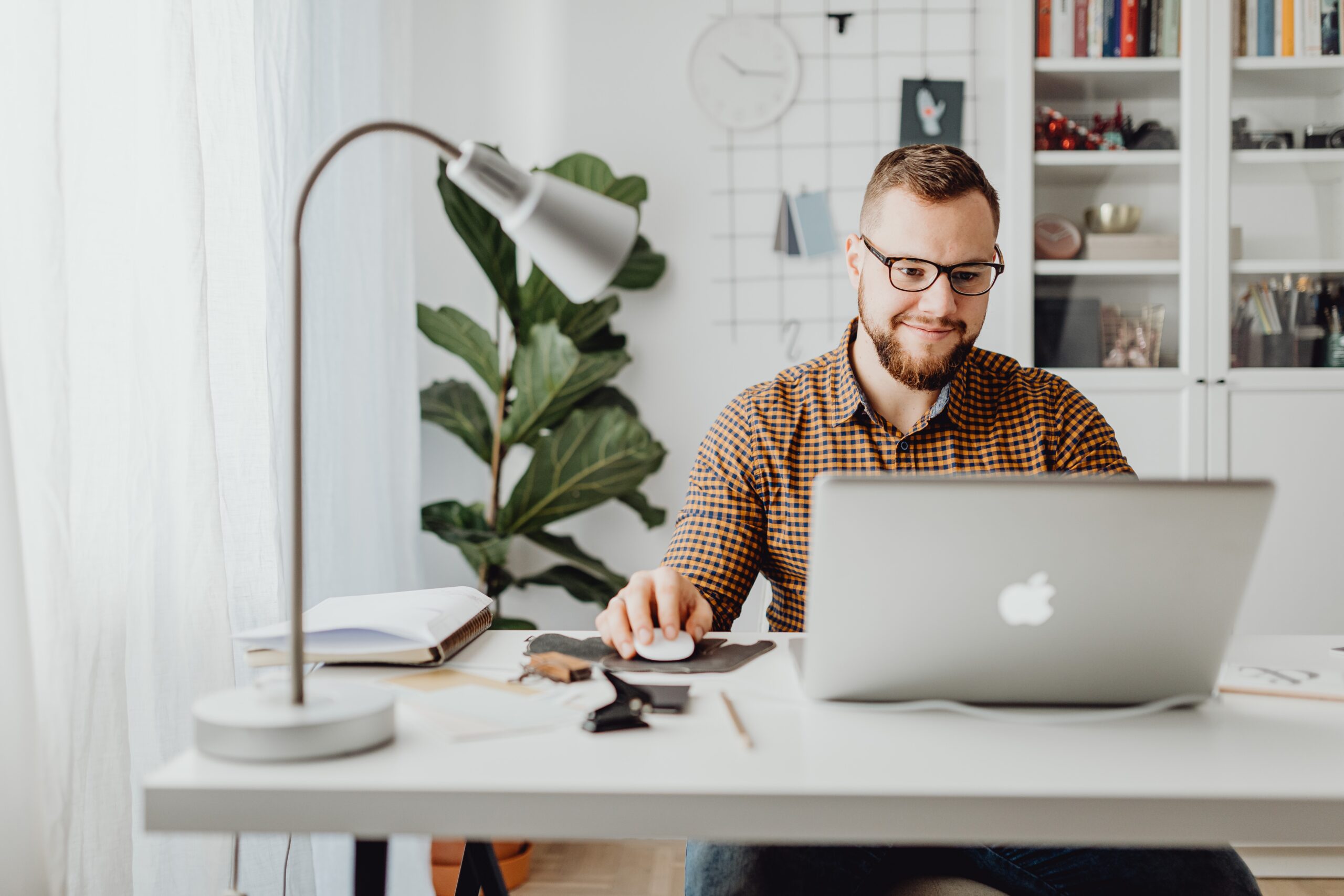 man working in the real estate office on computer
